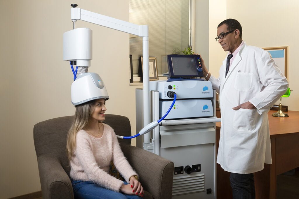 Illustration of TMS therapy being used to treat PTSD and anxiety, showing a patient undergoing non-invasive magnetic brain stimulation.