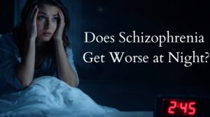 Woman awake at night with anxiety and insomnia, illustrating schizophrenia symptoms worsening at night.
