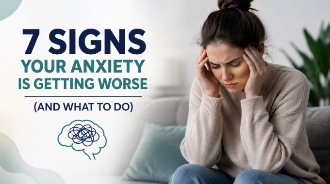Woman holding her head showing anxiety with text about signs anxiety is getting worse